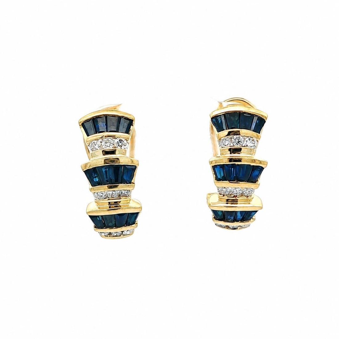 14k Yellow Gold Cuff Earrings with Baguette Sapphires and Round Diamonds: 14k Yellow Gold Cuff Earrings with Baguette Sapphires and Round Diamonds Elegant flared tiered cuff earrings crafted in solid 14k yellow gold, featuring natural baguette-cut blue sapphires accented by