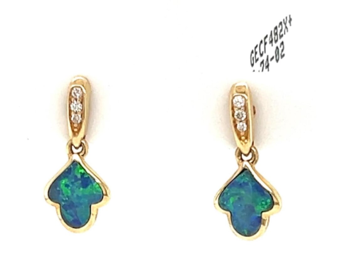 Kabana Leaf Dangle Earrings 14k Yellow Gold Fire Opal Diamond Pair: Kabana Leaf Dangle Earrings 14k Yellow Gold Fire Opal Diamond Pair Pre-owned Kabana leaf-inspired dangle earrings crafted in 14k yellow gold. This pair features natural fire opal accented by natural d