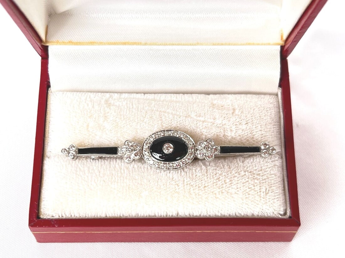 French Art Deco Style Brooch in 18K White Gold with Diamond Onyx: French Art Deco Style Brooch in 18K White Gold with Diamond Onyx French Art Deco style brooch crafted in 18K white gold with diamond and onyx accents, dating to circa the 1980s. This pre-owned piece f