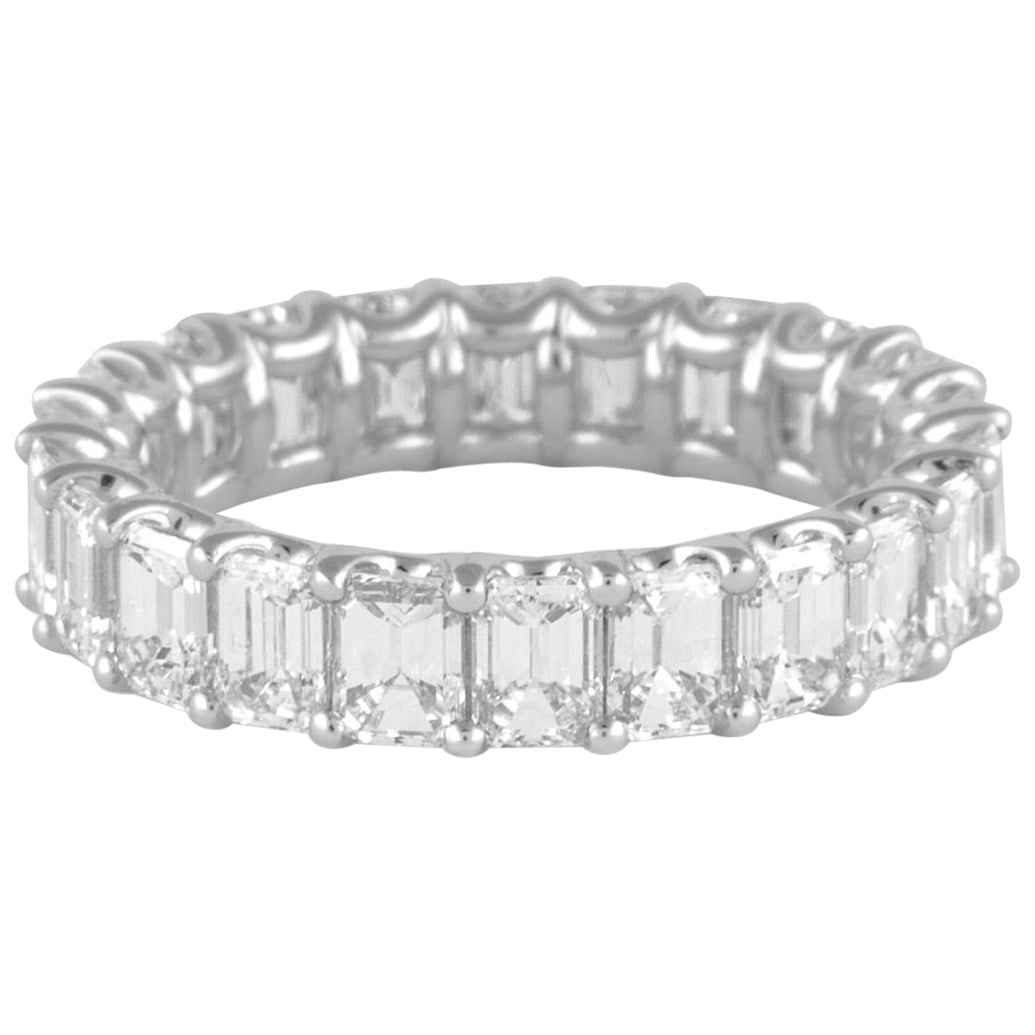 18k White Gold Diamond Eternity Ring 4.68ct Size 6.25: 18k White Gold Diamond Eternity Ring 4.68ct Size 6.25 Emerald cut diamond eternity band set with 22 white diamonds totaling 4.68 ct in 18k white gold. This contemporary ring is a US size 6.25 and is n