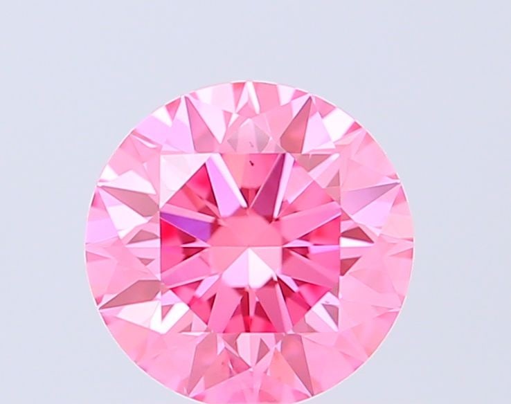 Ideal Loose Diamond - ROUND 0.71ct Fancy Vivid Pink VS1: Ideal Loose Diamond - ROUND 0.71ct Fancy Vivid Pink VS1 Source: This is a real non-mined Diamond that has been grown in a lab Shape: ROUND Carats: 0.71 Color: Fancy Vivid Pink Certification: IGI Video