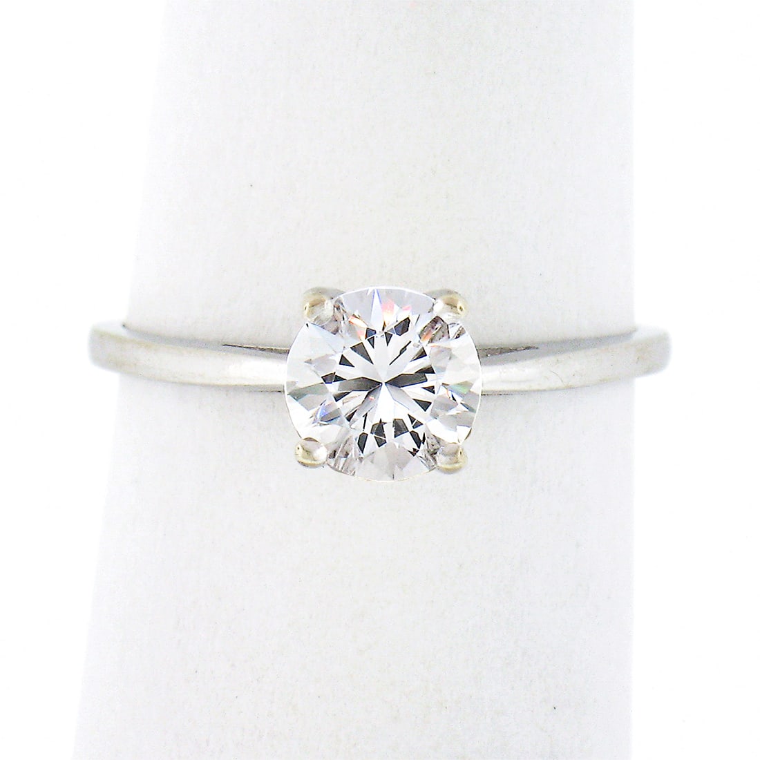 Vintage 14k White Gold Cubic Zirconia Solitaire Engagement Ring: Vintage 14k White Gold Cubic Zirconia Solitaire Engagement Ring This stunning vintage solitaire engagement ring is crafted from solid 14k white gold, showcasing a high-quality round brilliant cut cubi