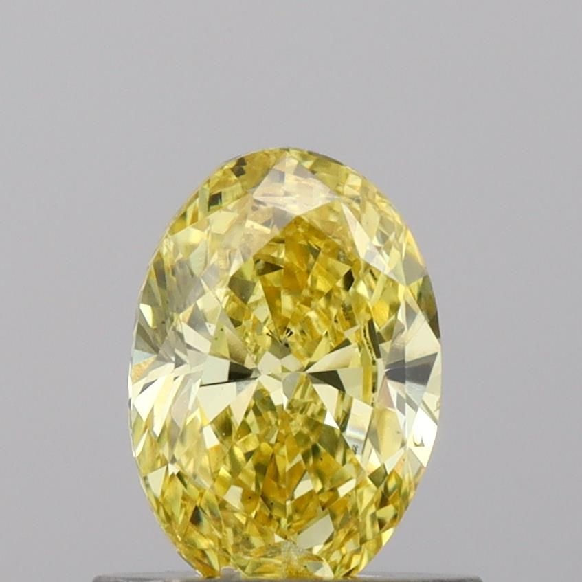 Loose Diamond - OVAL 0.75ct Fancy Vivid Yellow SI1: Loose Diamond - OVAL 0.75ct Fancy Vivid Yellow SI1 Source: This is a real non-mined Diamond that has been grown in a lab Shape: OVAL Carats: 0.75 Color: Fancy Vivid Yellow Certification: IGI Video: