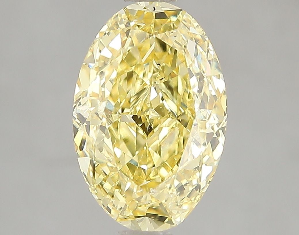 Loose Diamond - OVAL 3.01ct Fancy Vivid Yellow SI2: Loose Diamond - OVAL 3.01ct Fancy Vivid Yellow SI2 Source: This is a real non-mined Diamond that has been grown in a lab Shape: OVAL Carats: 3.01 Color: Fancy Vivid Yellow Certification: IGI Video: