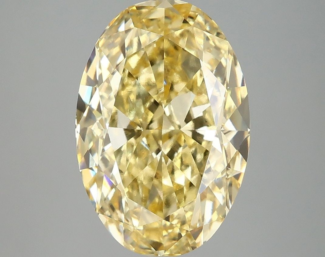 Loose Diamond - OVAL 5.08ct Fancy Vivid Yellow VS1: Loose Diamond - OVAL 5.08ct Fancy Vivid Yellow VS1 Source: This is a real non-mined Diamond that has been grown in a lab Shape: OVAL Carats: 5.08 Color: Fancy Vivid Yellow Certification: IGI Video:
