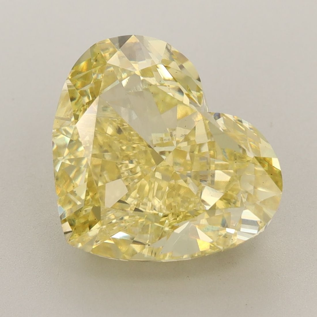 Loose Diamond - HEART 7.02ct Fancy Vivid Yellow VS1: Loose Diamond - HEART 7.02ct Fancy Vivid Yellow VS1 Source: This is a real non-mined Diamond that has been grown in a lab Shape: HEART Carats: 7.02 Color: Fancy Vivid Yellow Certification: IGI Video: