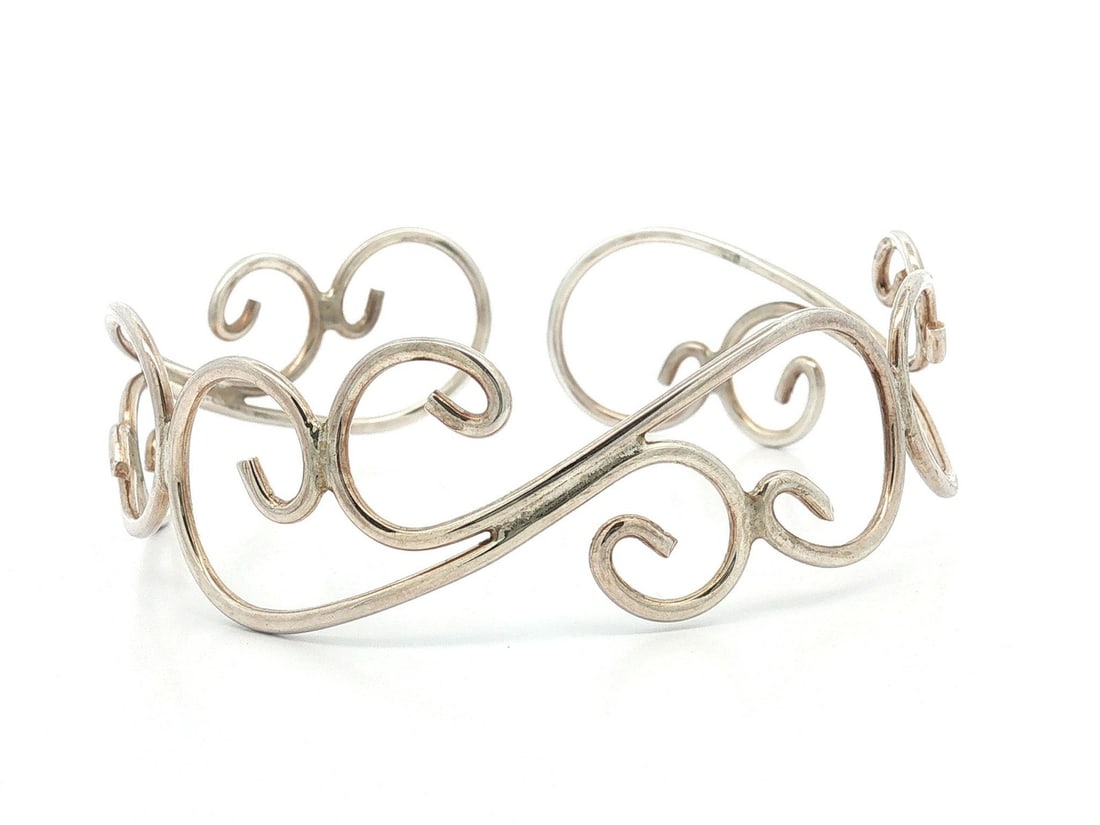 Sterling Silver Wide Cuff Bangle Openwork Handmade: Sterling Silver Wide Cuff Bangle Openwork Handmade Handmade sterling silver open work cuff bracelet with an ornate wide design. This pre-owned bracelet is and shows light surface wear, with excellent 
