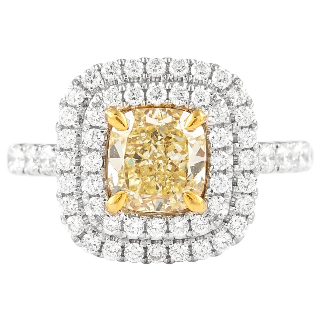 Fancy Yellow VS2 Diamond Halo Ring in 18k Gold: Fancy Yellow VS2 Diamond Halo Ring in 18k Gold Contemporary double halo ring featuring an EGL-certified Fancy Yellow VS2 cushion-cut diamond at the center, accented by round brilliant diamonds in a tw