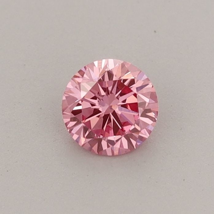 Loose Diamond - ROUND 0.32ct Fancy Vivid Pink VVS2: Loose Diamond - ROUND 0.32ct Fancy Vivid Pink VVS2 Source: This is a real non-mined Diamond that has been grown in a lab Shape: ROUND Carats: 0.32 Color: Fancy Vivid Pink Certification: IGI Video: