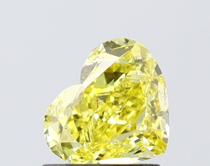 Loose Diamond - HEART 1.01ct Fancy Intense Yellow SI2: Loose Diamond - HEART 1.01ct Fancy Intense Yellow SI2 Source: This is a real non-mined Diamond that has been grown in a lab Shape: HEART Carats: 1.01 Color: Fancy Intense Yellow Certification: IGI Vid