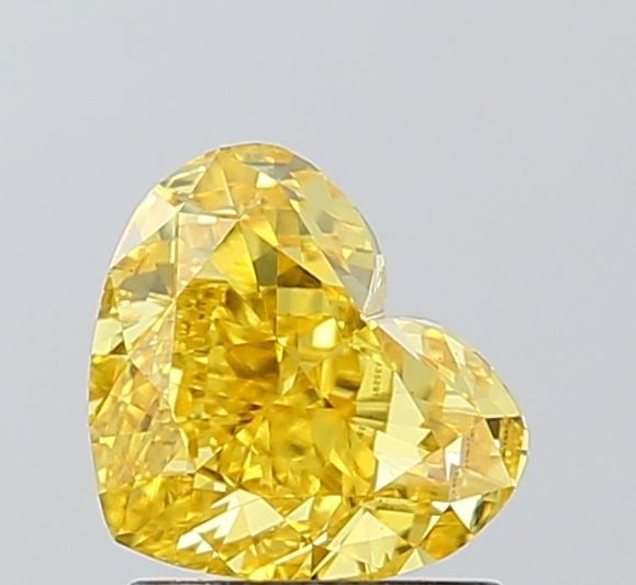 Loose Diamond - HEART 1.56ct Fancy Vivid Yellow VS1: Loose Diamond - HEART 1.56ct Fancy Vivid Yellow VS1 Source: This is a real non-mined Diamond that has been grown in a lab Shape: HEART Carats: 1.56 Color: Fancy Vivid Yellow Certification: IGI The Dia