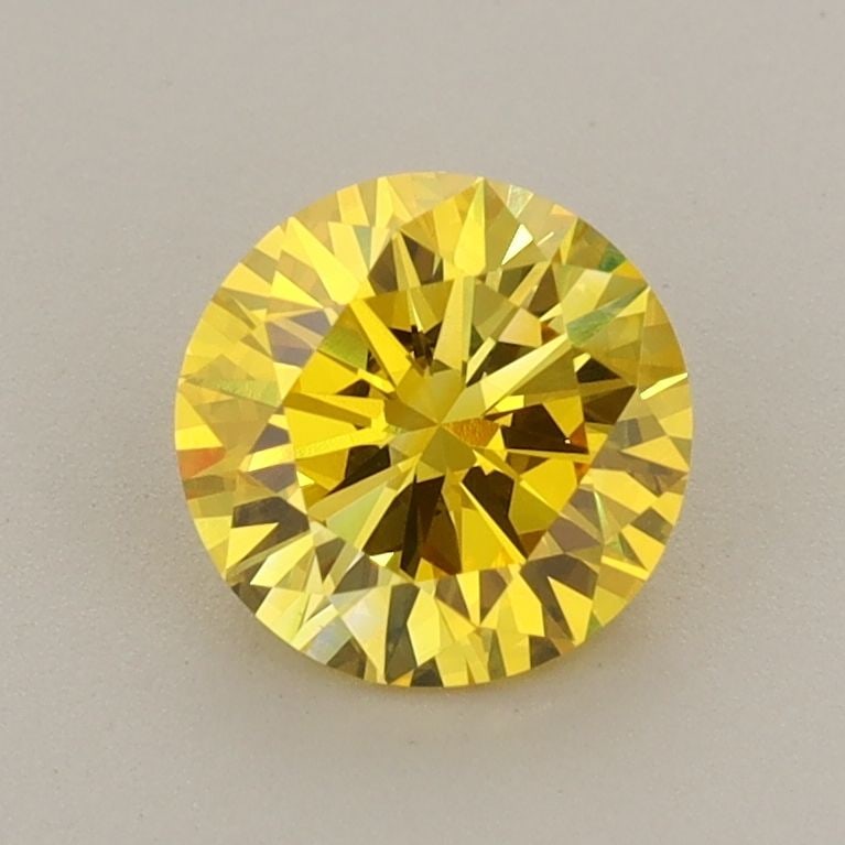 Loose Diamond - ROUND 1.03ct Fancy Vivid Yellow VVS2: Loose Diamond - ROUND 1.03ct Fancy Vivid Yellow VVS2 Source: This is a real non-mined Diamond that has been grown in a lab Shape: ROUND Carats: 1.03 Color: Fancy Vivid Yellow Certification: IGI The Di