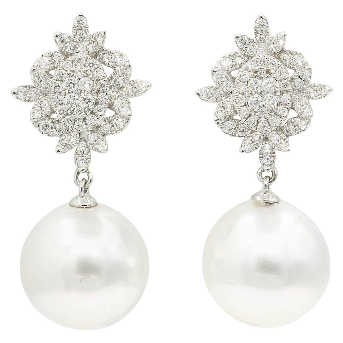 18K White Gold South Sea Pearl Drop Earrings with 0.80 Carat Diamonds: 18K White Gold South Sea Pearl Drop Earrings with 0.80 Carat Diamonds Contemporary drop earrings crafted in 18k white gold, featuring a diamond cluster design with South Sea pearl drops. Presented in 