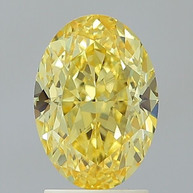 Loose Diamond - OVAL 3.06ct Fancy Vivid Yellow VVS2: Loose Diamond - OVAL 3.06ct Fancy Vivid Yellow VVS2 Source: This is a real non-mined Diamond that has been grown in a lab Shape: OVAL Carats: 3.06 Color: Fancy Vivid Yellow Certification: IGI Video: