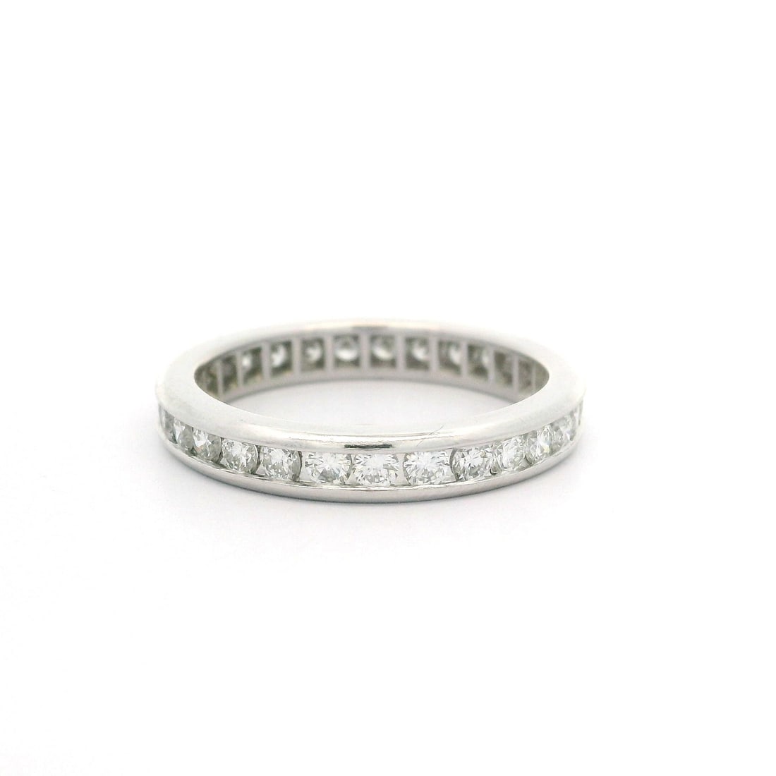 Platinum 1.02ctw Round Diamond Channel Set Eternity Band Ring: Platinum 1.02ctw Round Diamond Channel Set Eternity Band Ring This exquisite Classic Platinum 1.02ctw Round Channel Set Diamond Eternity Band Ring features a stunning array of natural diamonds. Set in