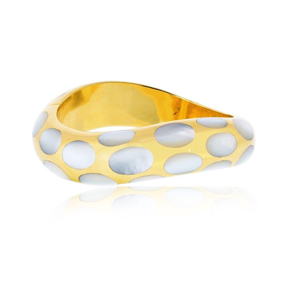 Tiffany & Co. Angela Cummings 18K Yellow Gold Mother of Pearl Bangle: Tiffany & Co. Angela Cummings 18K Yellow Gold Mother of Pearl Bangle Pre-owned Tiffany & Co. bangle bracelet designed by Angela Cummings, crafted in 18K yellow gold with mother of pearl accents. Speci