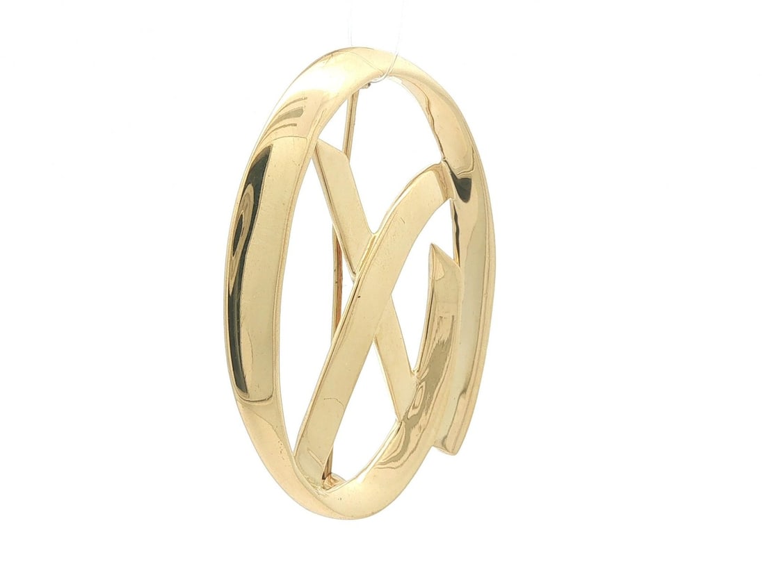 Tiffany & Co. Paloma Picasso Open Oval X Brooch 18k Yellow Gold 1985: Tiffany & Co. Paloma Picasso Open Oval X Brooch 18k Yellow Gold 1985 Paloma Picasso for Tiffany & Co. open oval pin brooch featuring an "X" motif in solid 18k yellow gold. This 1985 piece has a pin ba