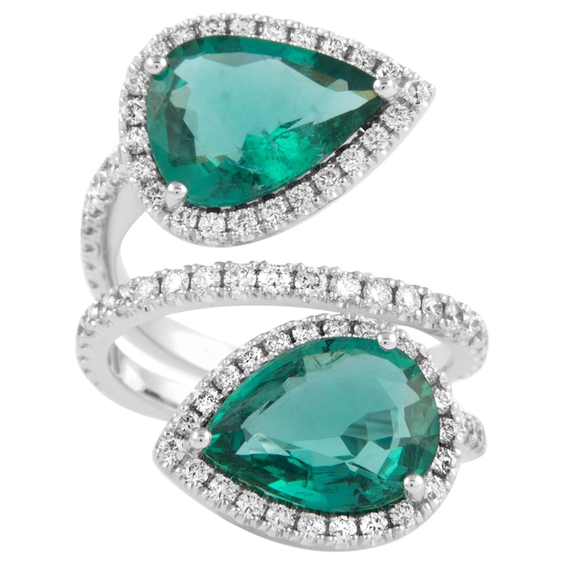 Emerald Diamond Bypass Ring in 18k White Gold: Emerald Diamond Bypass Ring in 18k White Gold Contemporary toi et moi bypass ring featuring two pear-cut emeralds and round brilliant diamonds in 18k white gold. The ring has a floating design and is 