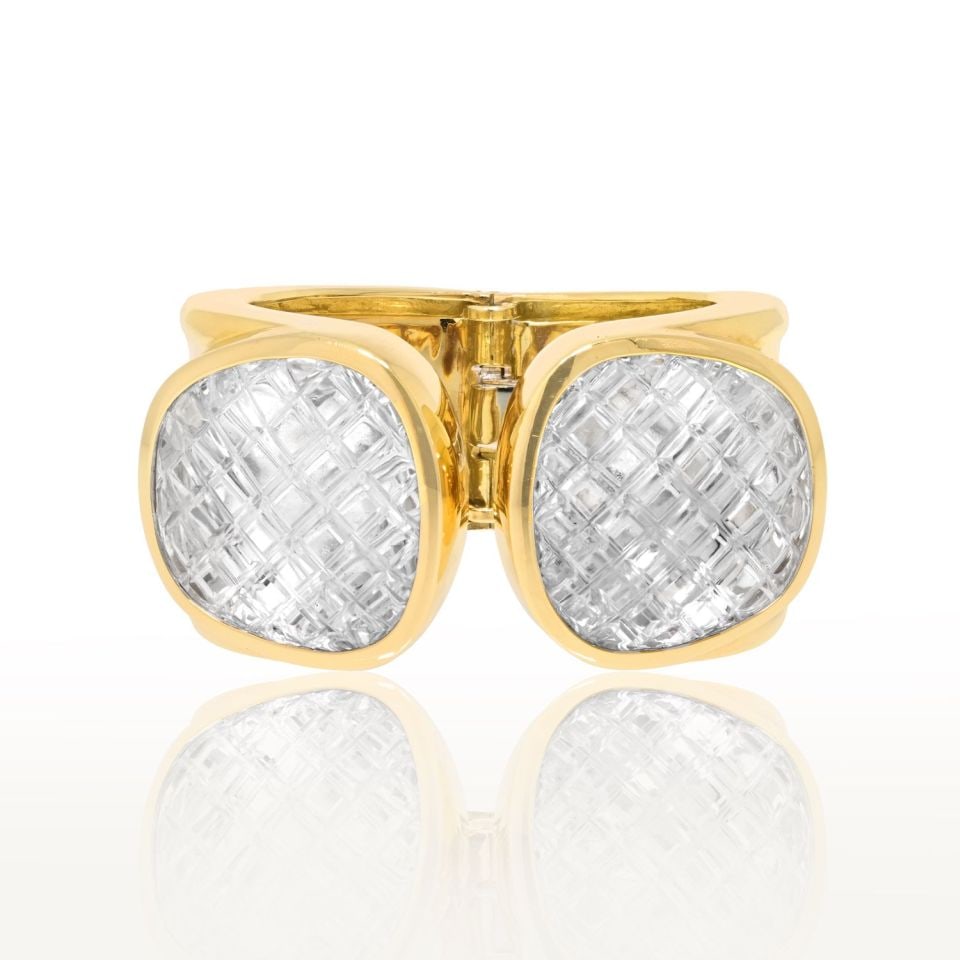 David Webb Rock Crystal Bracelet in Platinum and 18K Yellow Gold: David Webb Rock Crystal Bracelet in Platinum and 18K Yellow Gold Pre-owned David Webb bracelet featuring platinum and 18K yellow gold with two modified cushion-shaped, cross-hatch carved rock crystal 