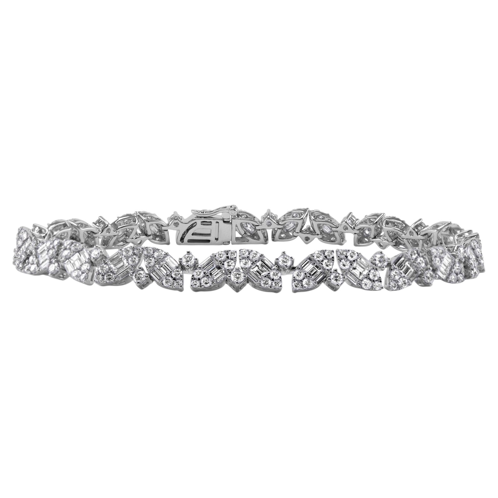 18k White Gold Diamond Bracelet 5.05ct Illusion Set: 18k White Gold Diamond Bracelet 5.05ct Illusion Set Illusion set natural diamond bracelet featuring 260 round and baguette cut diamonds with the look of marquise cut stones. Crafted in 18k white gold 