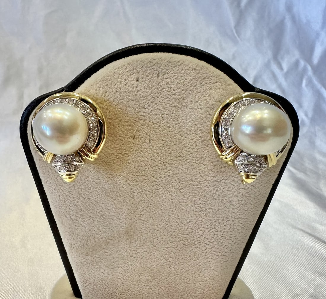 Pair of French 18k Gold Cuff Earrings with Pearls and Diamonds: Pair of French 18k Gold Cuff Earrings with Pearls and Diamonds Pair of French cuff earrings crafted in 18k yellow and white gold, featuring pearls accented by diamonds. These pre-owned earrings are fu