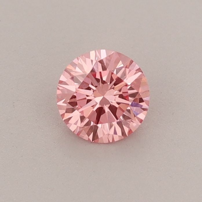 Loose Diamond - ROUND 0.34ct Fancy Vivid Pink VVS2: Loose Diamond - ROUND 0.34ct Fancy Vivid Pink VVS2 Source: This is a real non-mined Diamond that has been grown in a lab Shape: ROUND Carats: 0.34 Color: Fancy Vivid Pink Certification: IGI Video: