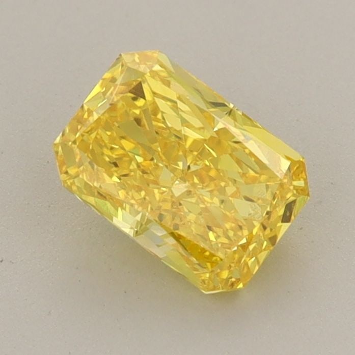 Loose Diamond - RADIANT 0.91ct Fancy Vivid Yellow VVS2: Loose Diamond - RADIANT 0.91ct Fancy Vivid Yellow VVS2 Source: This is a real non-mined Diamond that has been grown in a lab Shape: RADIANT Carats: 0.91 Color: Fancy Vivid Yellow Certification: IGI Vi