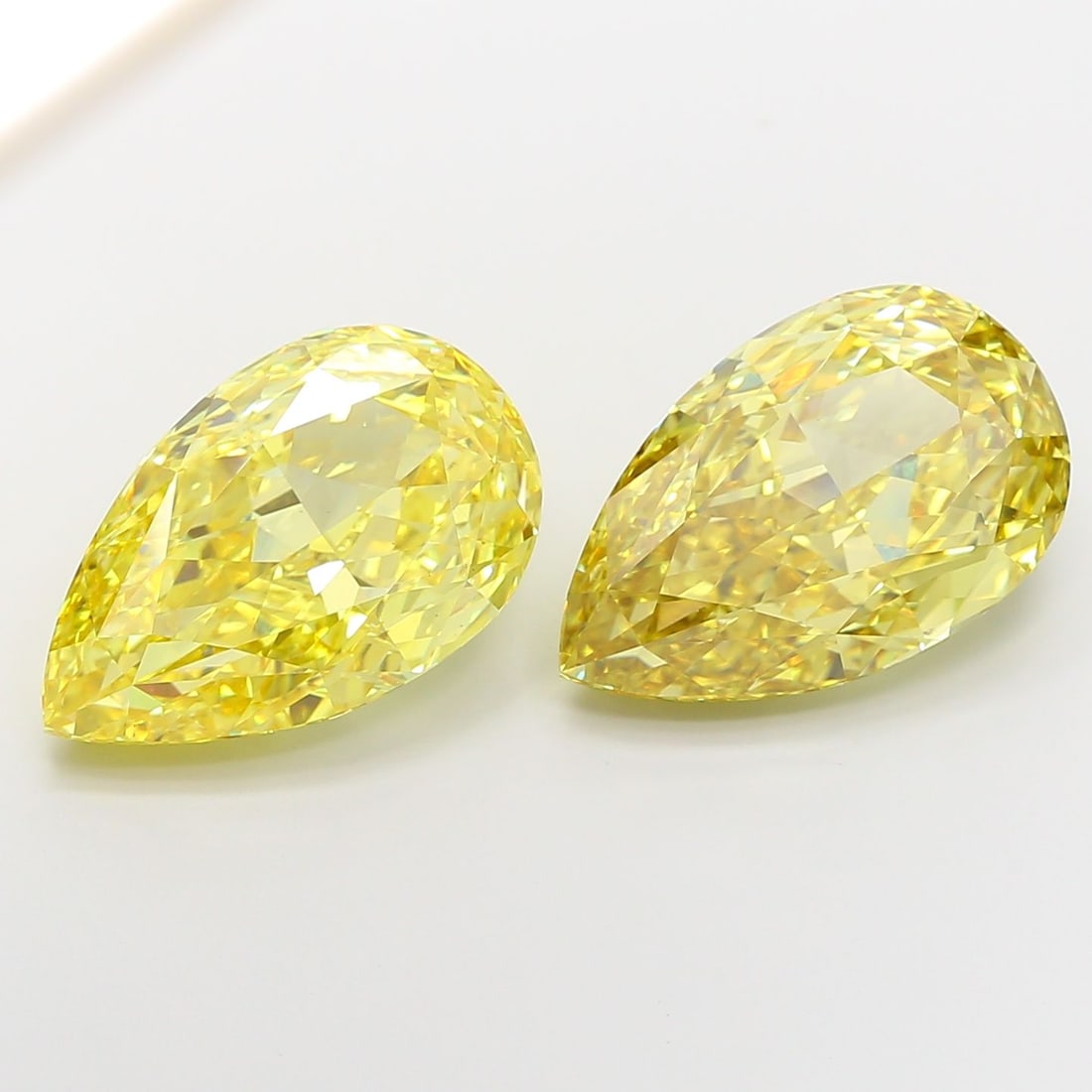 Loose Diamond - PEAR 10.56ct Fancy Intense Yellow VVS2: Loose Diamond - PEAR 10.56ct Fancy Intense Yellow VVS2 Source: This is a real non-mined Diamond that has been grown in a lab Shape: PEAR Carats: 10.56 Color: Fancy Intense Yellow Certification: IGI Vi