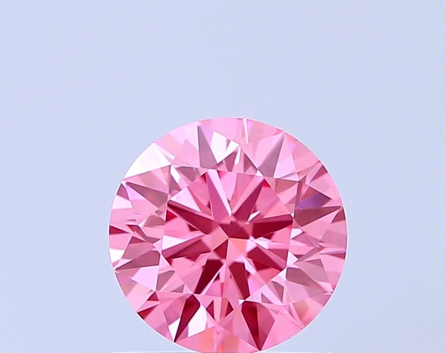 Ideal Loose Diamond - ROUND 0.93ct Fancy Vivid Pink VVS2: Ideal Loose Diamond - ROUND 0.93ct Fancy Vivid Pink VVS2 Source: This is a real non-mined Diamond that has been grown in a lab Shape: ROUND Carats: 0.93 Color: Fancy Vivid Pink Certification: IGI The 