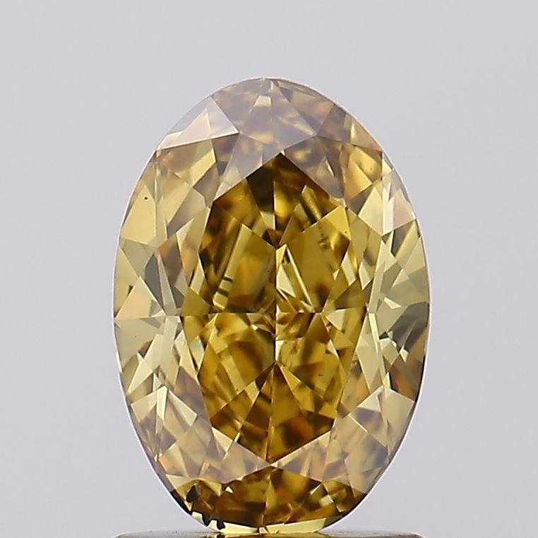 Loose Diamond - OVAL 1.16ct Fancy Brownish Yellow VS2: Loose Diamond - OVAL 1.16ct Fancy Brownish Yellow VS2 Source: This is a real non-mined Diamond that has been grown in a lab Shape: OVAL Carats: 1.16 Color: Fancy Brownish Yellow Certification: IGI Vid