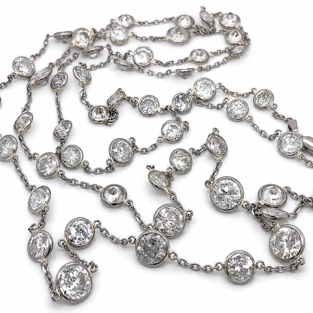 Diamond by the Yard Necklace in 14K White Gold Platinum 28.00 Ct: Diamond by the Yard Necklace in 14K White Gold Platinum 28.00 Ct Pre-owned diamond by the yard necklace crafted in 14K white gold and platinum. The necklace is set with 53 diamonds for an approximate 