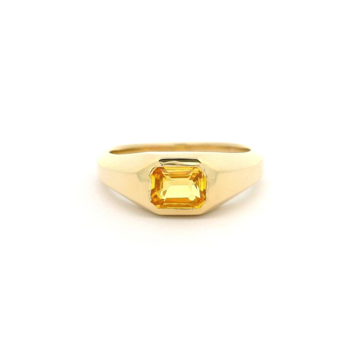 14k Yellow Gold 1.12ct Emerald Cut Yellow Sapphire Band Ring: 14k Yellow Gold 1.12ct Emerald Cut Yellow Sapphire Band Ring This exquisite solitaire band ring features a stunning natural yellow sapphire, elegantly crafted in solid 14k yellow gold. The emerald