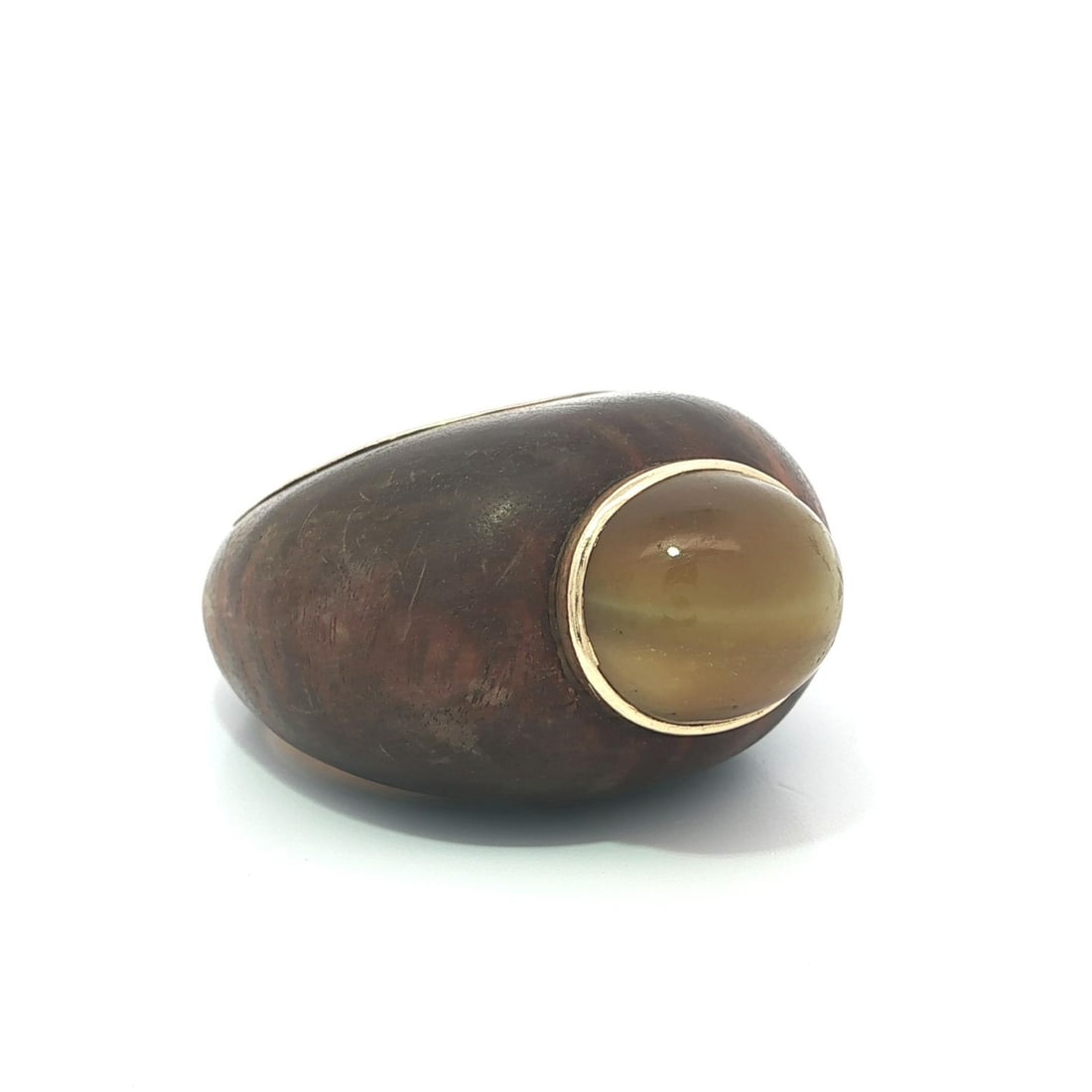 Solid Yellow Gold Tiger Eye Cabochon Wood Ring Size 5: Solid Yellow Gold Tiger Eye Cabochon Wood Ring Size 5 This exquisite wood ring features a solid yellow gold bezel set with a stunning natural tiger's eye stone. The oval cabochon cut stone, measuring 