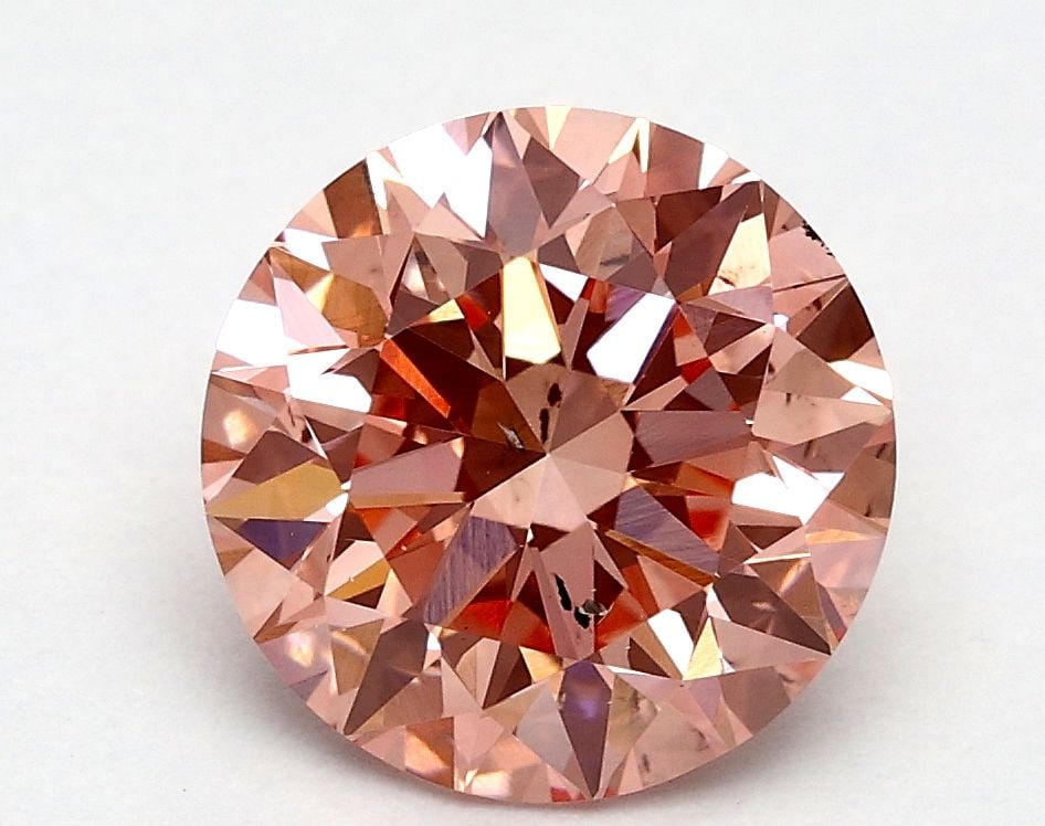 Loose Diamond - ROUND 1.71ct Fancy Vivid Pink SI1: Loose Diamond - ROUND 1.71ct Fancy Vivid Pink SI1 Source: This is a real non-mined Diamond that has been grown in a lab Shape: ROUND Carats: 1.71 Color: Fancy Vivid Pink Certification: IGI Video: