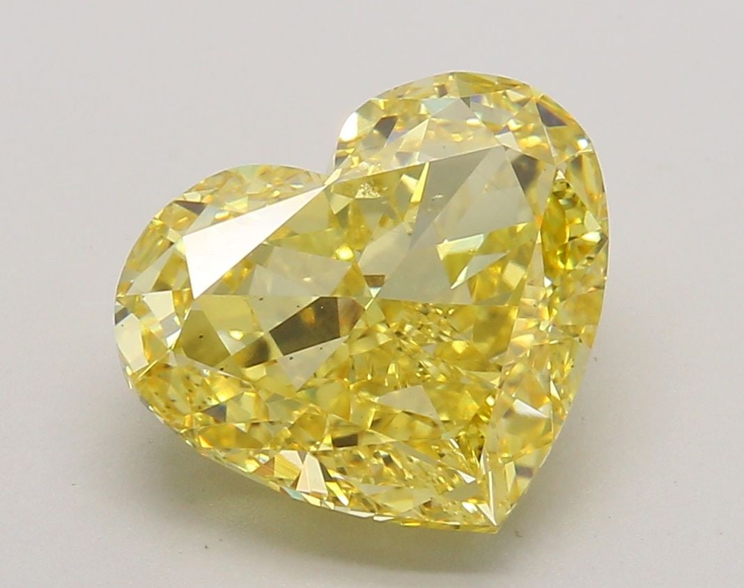 Loose Diamond - HEART 5.01ct Fancy Vivid Yellow VS2: Loose Diamond - HEART 5.01ct Fancy Vivid Yellow VS2 Source: This is a real non-mined Diamond that has been grown in a lab Shape: HEART Carats: 5.01 Color: Fancy Vivid Yellow Certification: IGI Video: