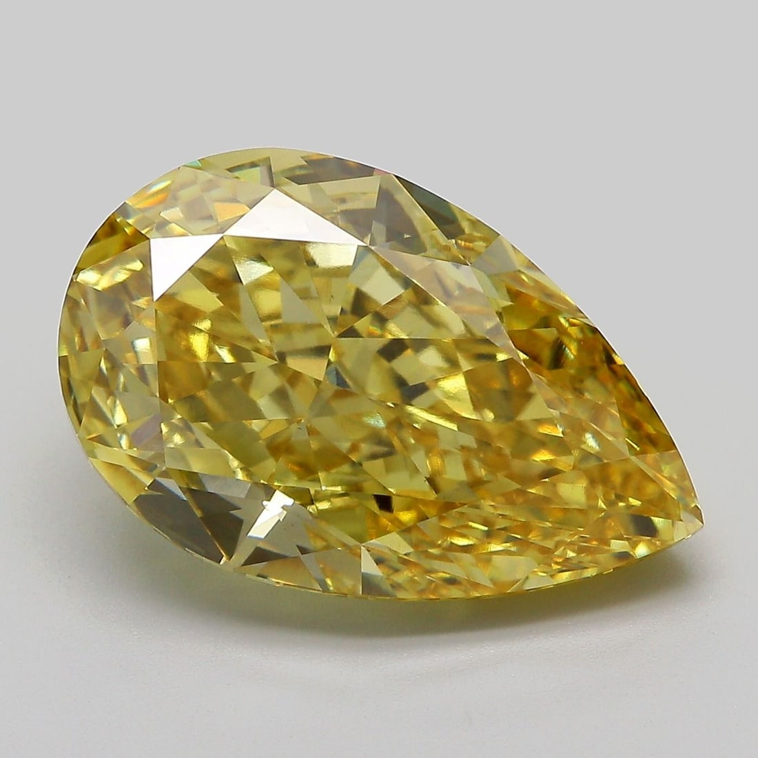 Loose Diamond - PEAR 10.27ct Fancy Vivid Yellow VS1: Loose Diamond - PEAR 10.27ct Fancy Vivid Yellow VS1 Source: This is a real non-mined Diamond that has been grown in a lab Shape: PEAR Carats: 10.27 Color: Fancy Vivid Yellow Certification: IGI Video: