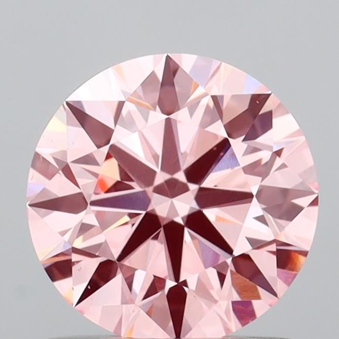 Ideal Loose Diamond - ROUND 0.98ct Fancy Vivid Pink VVS2: Ideal Loose Diamond - ROUND 0.98ct Fancy Vivid Pink VVS2 Source: This is a real non-mined Diamond that has been grown in a lab Shape: ROUND Carats: 0.98 Color: Fancy Vivid Pink Certification: IGI Vide