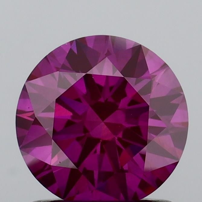 Ideal Loose Diamond - ROUND 1.04ct Fancy Vivid Pink VS1: Ideal Loose Diamond - ROUND 1.04ct Fancy Vivid Pink VS1 Source: This is a real non-mined Diamond that has been grown in a lab Shape: ROUND Carats: 1.04 Color: Fancy Vivid Pink Certification: IGI Video