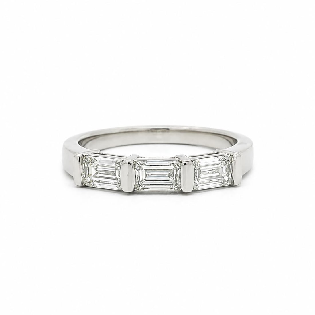 GIA Certified Platinum 3 Diamond East West Band Ring 1.10ctw D VVS: GIA Certified Platinum 3 Diamond East West Band Ring 1.10ctw D VVS Un-used women's cocktail band ring featuring three natural emerald-cut diamonds in an east-west bar channel setting. The diamonds hav