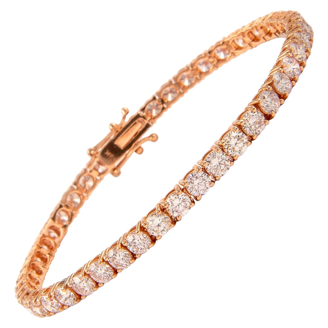 14k Rose Gold 9.10ct Diamond Tennis Bracelet: 14k Rose Gold 9.10ct Diamond Tennis Bracelet Exquisite and timeless diamond tennis bracelet set with 45 round brilliant diamonds totaling 9.10 carats in a four-prong 14k rose gold setting. The diamond