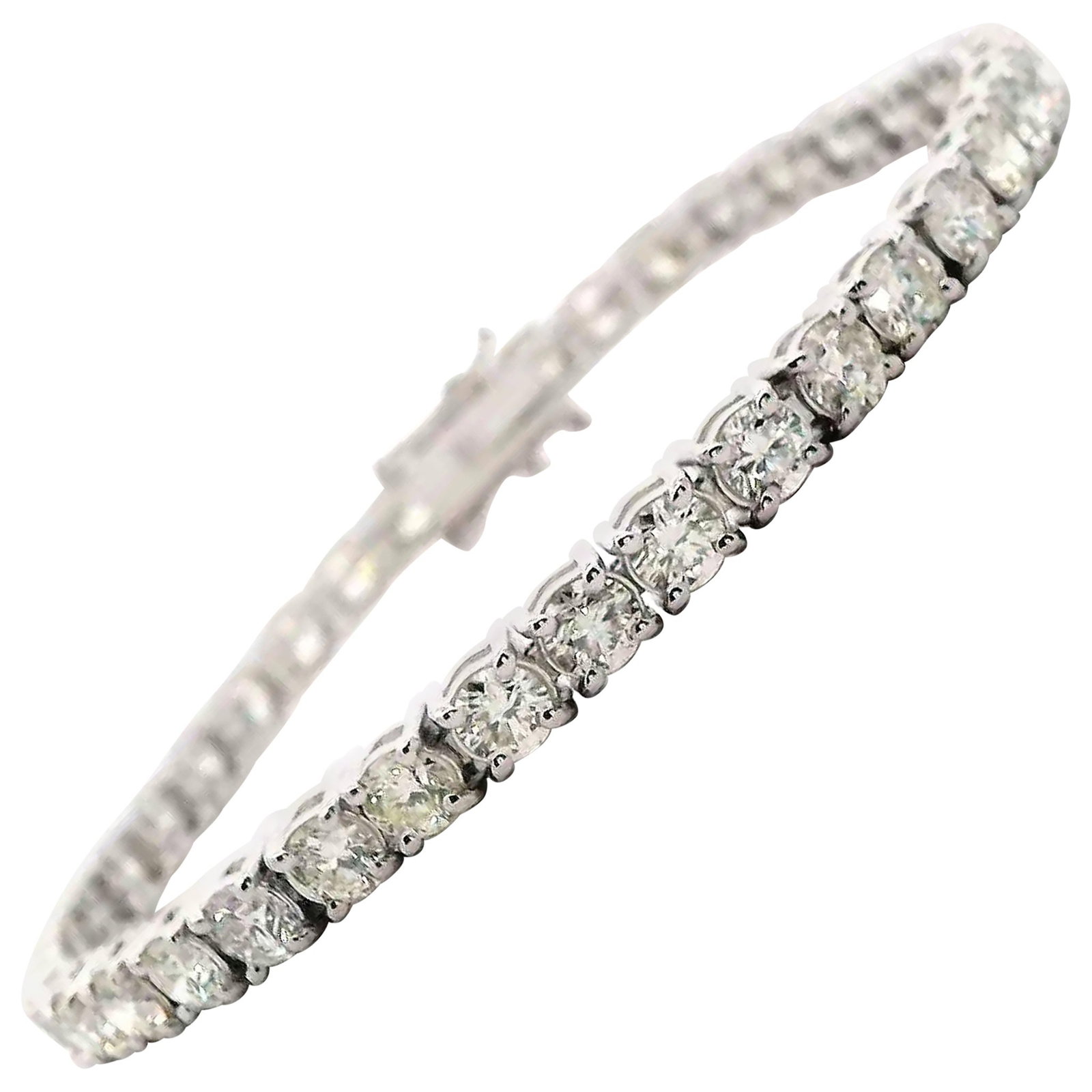 18k White Gold Diamond Tennis Bracelet 9.74ct: 18k White Gold Diamond Tennis Bracelet 9.74ct Diamond tennis bracelet set in 18k white gold with round white diamonds in a four-prong setting. This contemporary bracelet features 40 round brilliant di