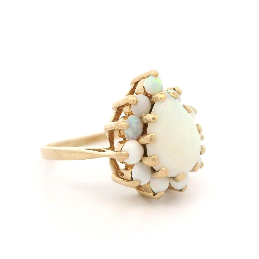 Vintage 10k Yellow Gold Opal Ring Pear Round Cabochon Cut: Vintage 10k Yellow Gold Opal Ring Pear Round Cabochon Cut This exquisite vintage ring features a stunning design crafted from solid 10k yellow gold. The centerpiece is a natural genuine pear-shaped op