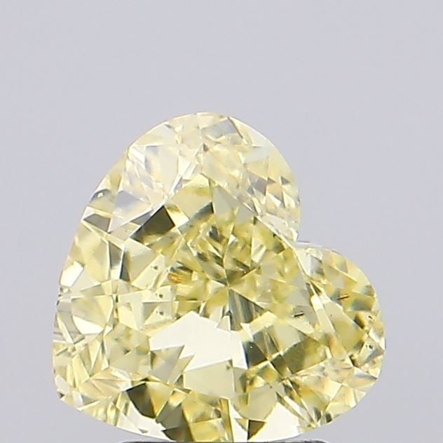 Loose Diamond - HEART 1.79ct Fancy Yellow VS2: Loose Diamond - HEART 1.79ct Fancy Yellow VS2 Source: This is a real non-mined Diamond that has been grown in a lab Shape: HEART Carats: 1.79 Color: Fancy Yellow Certification: IGI Video:
