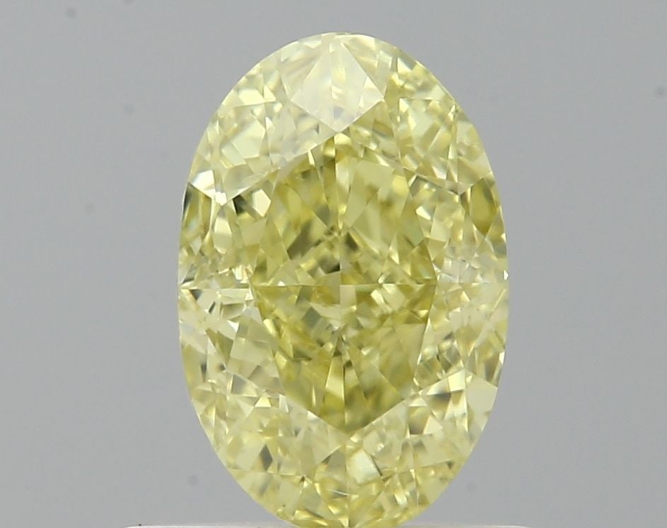 Loose Diamond - OVAL 0.71ct Fancy Yellow VS2: Loose Diamond - OVAL 0.71ct Fancy Yellow VS2 Source: Natural Shape: OVAL Carats: 0.71 Color: Fancy Yellow Certification: GIA The Diamond Depot Guarantee: All items in this auction are guaranteed to be
