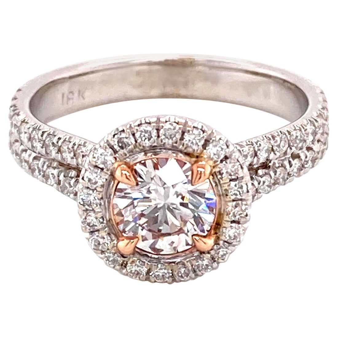 18k Gold Halo Ring GIA 1.25ctt Pinkish Brown Diamond: 18k Gold Halo Ring GIA 1.25ctt Pinkish Brown Diamond GIA-certified halo ring centered with a pinkish brown round brilliant diamond and accented by additional round brilliant diamonds. Crafted in two-t