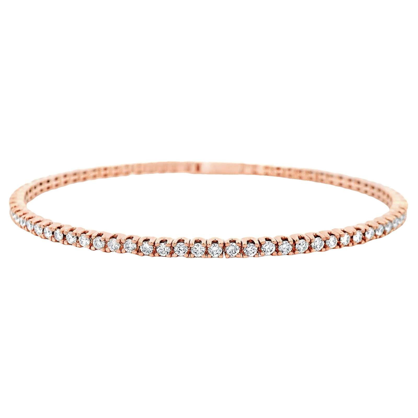 14k Rose Gold Diamond Tennis Bangle Bracelet 1.87ct: 14k Rose Gold Diamond Tennis Bangle Bracelet 1.87ct Flexible tennis bangle bracelet in 14k rose gold set with 71 round white diamonds totaling 1.87 ct. This contemporary bracelet dates to 2024 and is 