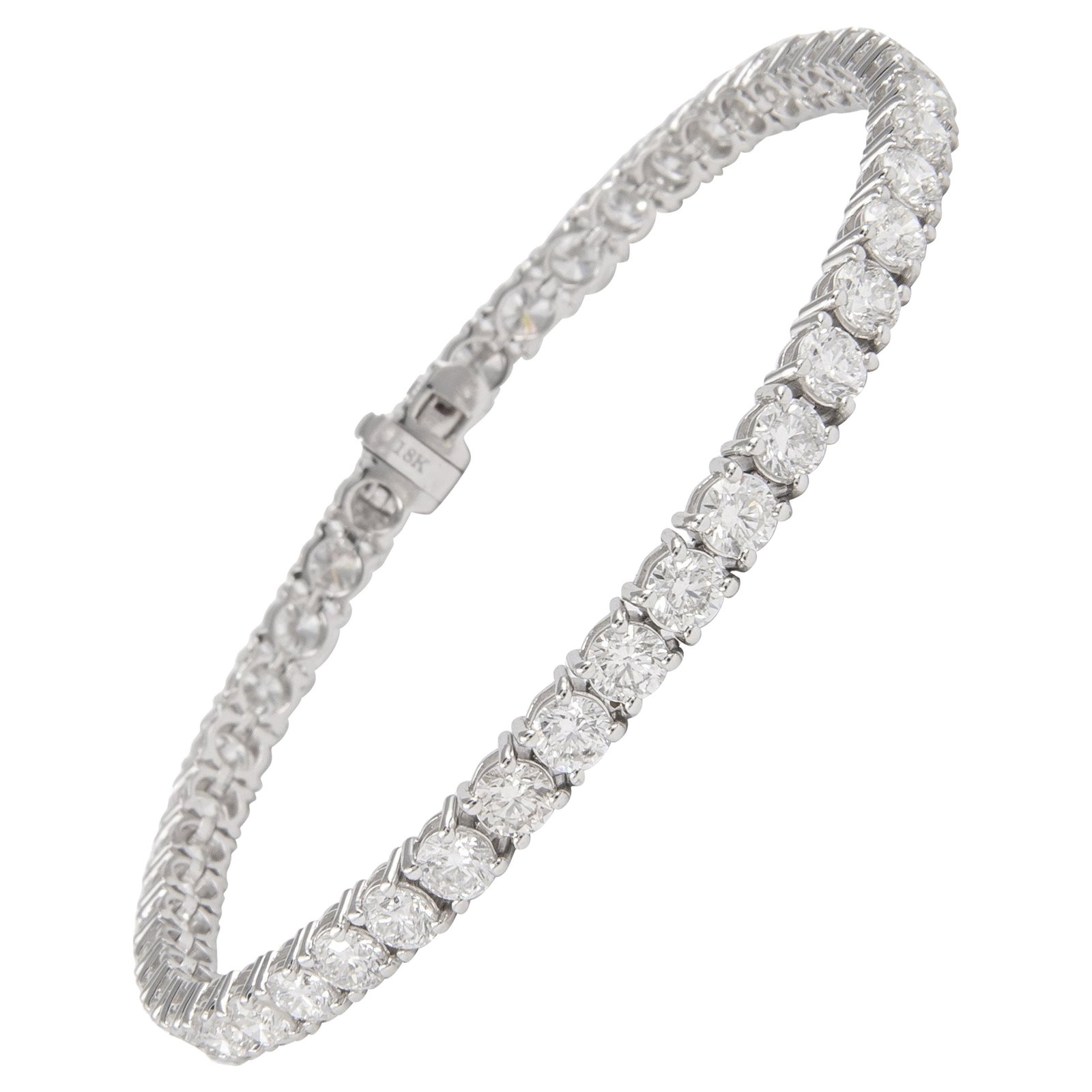 18k White Gold Diamond Tennis Bracelet 8.55ct: 18k White Gold Diamond Tennis Bracelet 8.55ct Contemporary diamond tennis bracelet set with 45 round brilliant white diamonds totaling 8.55 ct in a four-prong 18k white gold setting. This un-used brac