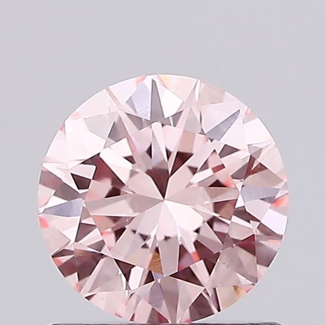 Loose Diamond - ROUND 0.73ct Fancy Vivid Pink VS1: Loose Diamond - ROUND 0.73ct Fancy Vivid Pink VS1 Source: This is a real non-mined Diamond that has been grown in a lab Shape: ROUND Carats: 0.73 Color: Fancy Vivid Pink Certification: IGI Video: