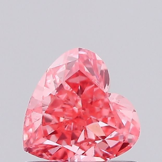 Loose Diamond - HEART 0.66ct Fancy Vivid Pink VS2: Loose Diamond - HEART 0.66ct Fancy Vivid Pink VS2 Source: This is a real non-mined Diamond that has been grown in a lab Shape: HEART Carats: 0.66 Color: Fancy Vivid Pink Certification: IGI Video: