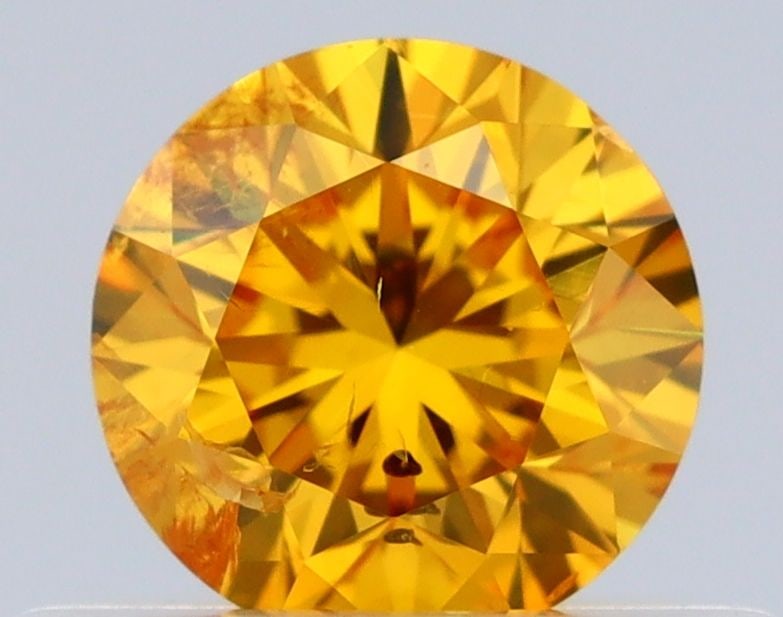 Loose Diamond - ROUND 0.4ct Fancy Vivid Orangey Yellow I2: Loose Diamond - ROUND 0.4ct Fancy Vivid Orangey Yellow I2 Source: Natural Shape: ROUND Carats: 0.4 Color: Fancy Vivid Orangey Yellow Certification: GIA Video: Video Link The Diamond Depot Guarantee: